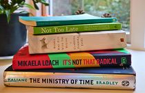 Well-loved copies of five incredible 'climate books'. 