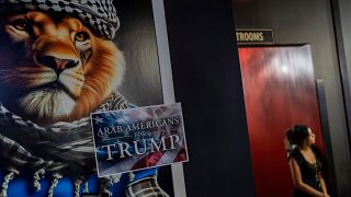 A sign is displayed during an Arab Americans for Trump election watch party at Lava Java Cafe, a hookah lounge, in the early hours of 6 November 2024, in Dearborn, Michigan