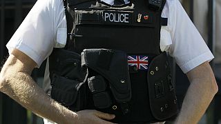 File photo: A British police officer keeps watch in Westminster, London, on March 28, 2012. 