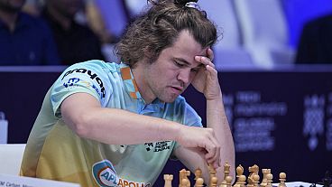 FILE - Norwegian Magnus Carlsen of SG Alpine Warriors plays Poland's Jan-Krzysztof Duda of Chingari Gulf Titans during Global Chess League, July 1, 2023, in Dubai, UAE