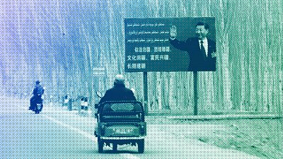 Chinese President Xi Jinping is seen on a billboard in Yarkent County in northwestern China's Xinjiang Uyghur Autonomous Region, March 2021