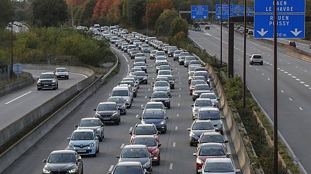 Commuters stuck in a rush-hour traffic jam on the outskirts of Paris