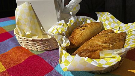 A basket of Mexican pastes sit on a patron's table before they are eated for lunch at the 16th International Paste Festival in Mineral del Monte