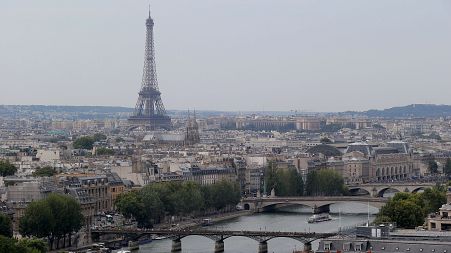 A view of the Eiffel tower along the Seine River in Paris, Friday, Aug. 22, 2013. (AP Photo/Michel Euler)