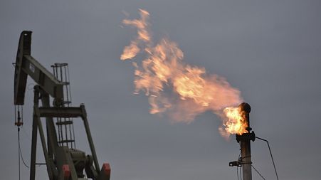 A flare for burning excess methane, or natural gas, from crude oil production at a well pad at North Dakota in the US